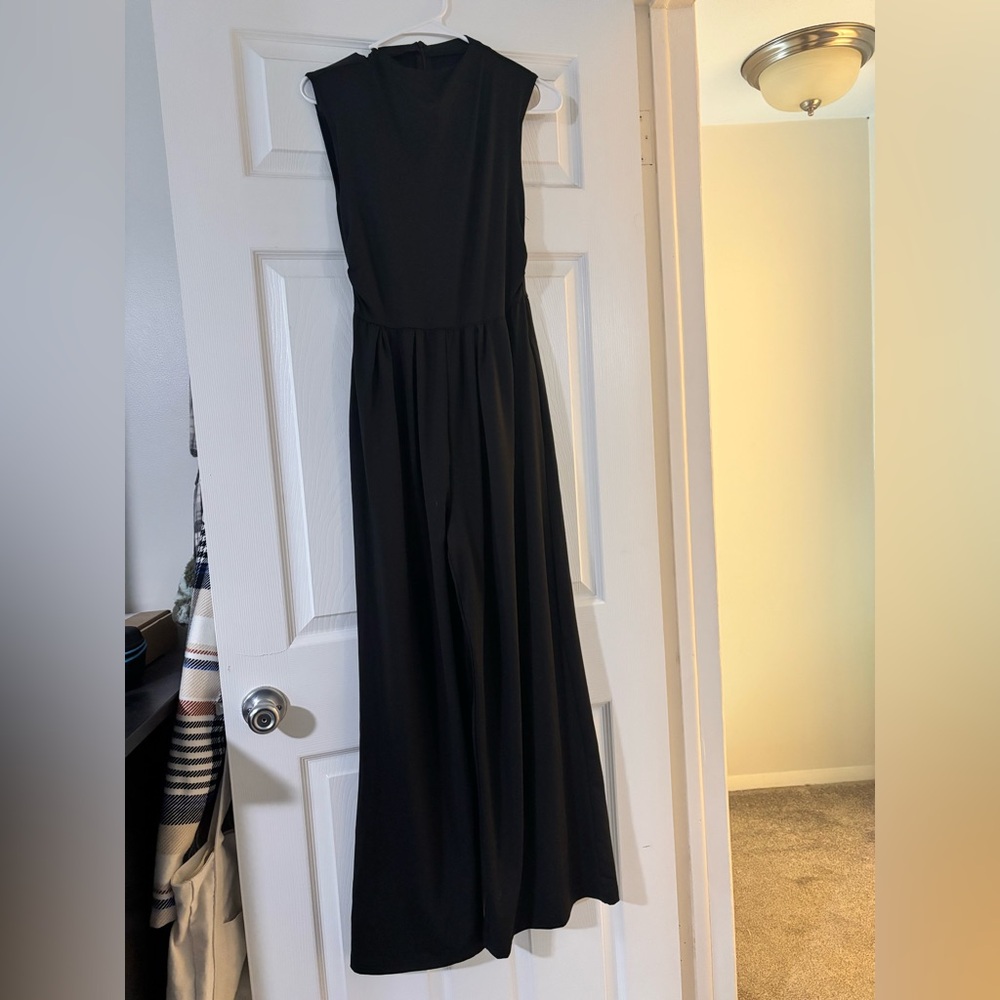 Black sleeveless flare legged romper